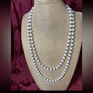 Vintage 26” white and gold-tone beaded necklace with a box clasp. Possibly Monet